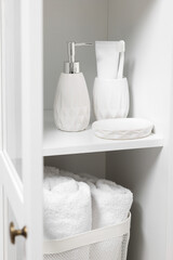 Different personal care products and bath accessories in bathroom vanity