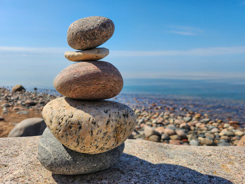 Tranquil Zen Stone Stacked on Pebble Beach with Blurred Water Background for Ultimate Relaxation, Serenity, and Inner Peace - Perfect Image for Meditation, Mindfulness, and Self-Care Practices