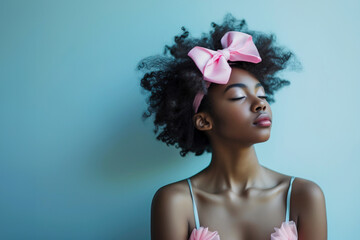 Young African American woman with coquette feminine style posing with eyes closed against light blue backgorund with copy space