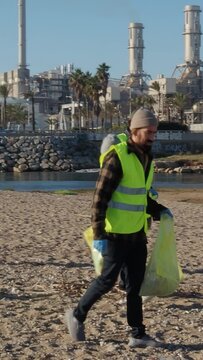Vertical video of Group of young ecologist volunteers collecting garbage