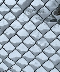 Snow pattern on chainlink fence