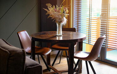 A vase of flowers on a table, interior photography