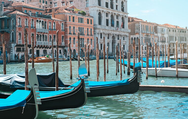 Fototapeta premium A beautiful canal with boats in Venice, Italy