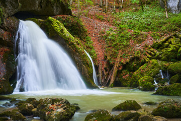 Long exposure landscape with a waterfall from a cave