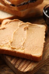 Tasty peanut butter sandwich on table, closeup view