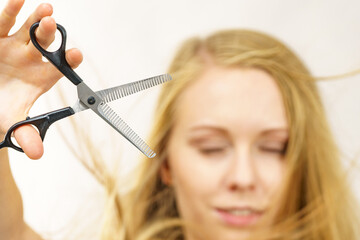 Girl with scissors thinning shears