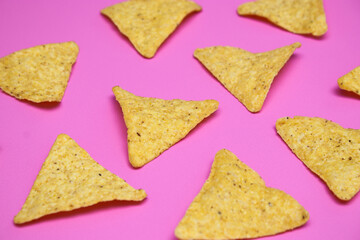 Tortilla chips isolated on bright pink background