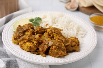 Delicious chicken curry with rice on table, closeup