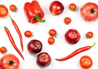 Variety of healthy organic only red color vegetables and fruits on white background. Top view of...