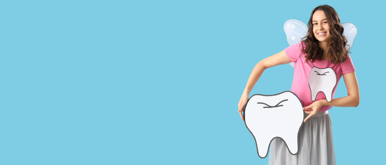 Tooth fairy with paper teeth on blue background with space for text