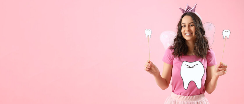 Tooth fairy with paper tooth and magic wands on pink background with space for text