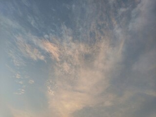 Naklejka na ściany i meble Aesthetic clouds visible at the evening sky