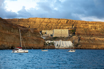 Hotels in volcanic landscape facing the sea from Puerto de Mogan in Las Palmas de Gran Canaria