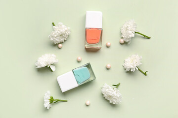Composition with stylish nail polishes, highlighter balls and beautiful chrysanthemum flowers on...