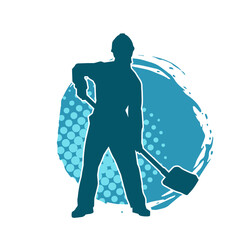 Silhouette of a worker carrying shovel tool. Silhouette of a worker in action pose using shovel tool.