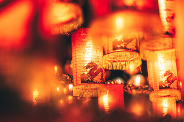 Red Chinese lantern(Translation Hieroglyph text Happy New Year) hanging in a row during day time for Chinese new year celebration.