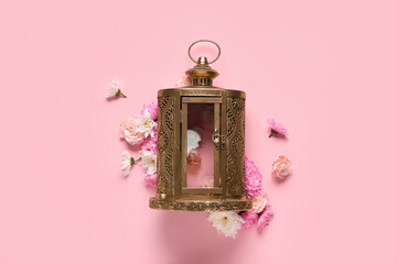 Muslim lamp with flowers on pink background. Ramadan celebration