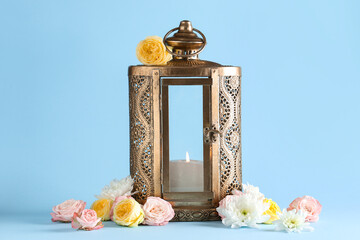 Muslim lamp with flowers on blue background. Ramadan celebration