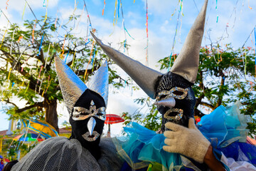 People wearing venice carnival costumes during festivities