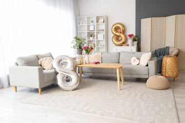 Interior of modern living room decorated for International Women's Day