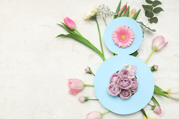Figure 8 made of paper and different beautiful flowers on white background. International Women's Day