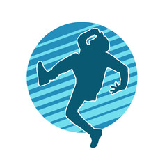 Silhouette of a male dancer in action pose. Silhouette of a slim man in dancing pose.
