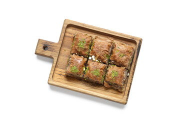 Wooden board with tasty Eastern sweets for Ramadan on white background