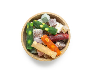 Wooden bowl with traditional Eastern sweets for Ramadan on white background