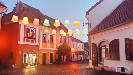 Tuinposter Hungary Szentendre colorful lanterns lights decorations in old town along Rhine river and Danube river  © NKM