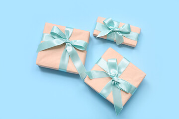 Fototapeta na wymiar Gift boxes on blue background. International Women's Day