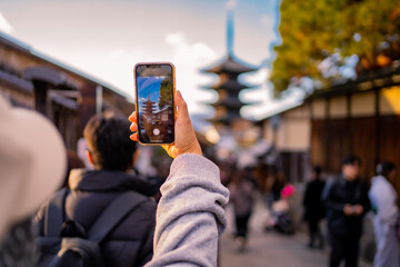 Yasaka Pagoda view and Hokan-ji Temple from Yasaka Dori street in Kyoto, Japan. Popular touristic...