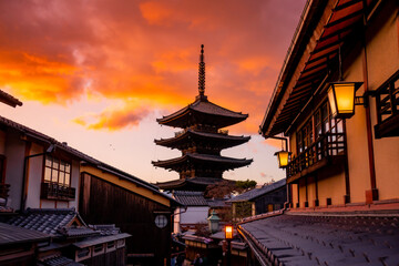 Yasaka Pagoda view and Hokan-ji Temple from Yasaka Dori street in Kyoto, Japan. Popular touristic street leading to Kyomizu Dera, Ninenzaka and Sennenzaka, In the evening, the sunset. 