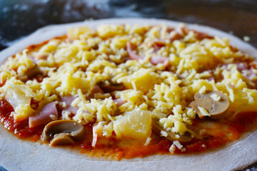 pizza with sausage on a black background