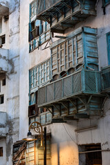 Fototapeta na wymiar Traditional balconies of the Al Balad neighborhood in the city of Jeddah.