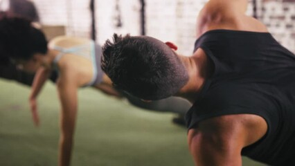 Man, exercise and class plank for workout at gym for healthy muscle, fitness training or athlete. Male person, woman and arms balance together for physical performance, challenge or cardio wellness