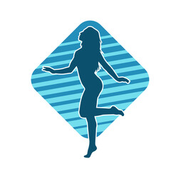 Silhouette of a slim female in dance pose. Silhouette of a woman dancing.