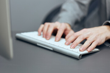 Businessman typing on keyboard at office