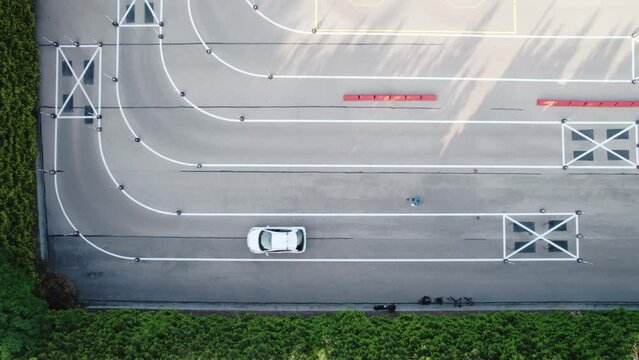 Aerial View of Car Driver during L-Turn Test Between Cones