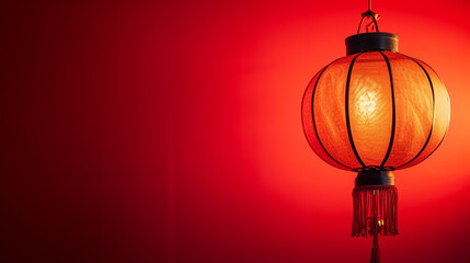 Fototapeta premium side view of lantern and lentern with red background copy space