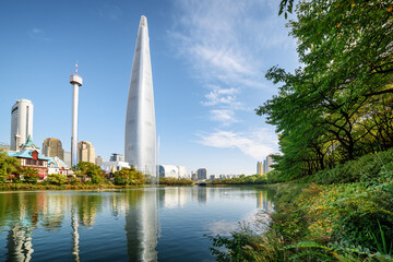 Lake among green trees in park at downtown of Seoul