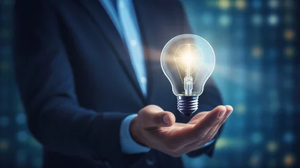 Foto op Plexiglas Business man holding technology light bulb glowing, creative innovation and business idea concept (1) © Hanasta