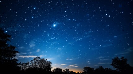 Naklejka premium The night sky, clouds and countless sparkling stars.