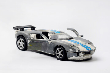 Fototapeta premium Children's toys, sports cars whose paint surface has peeled off due to long use