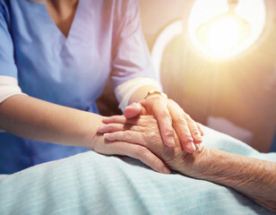 Taking care of the elderly concept with young woman holding the hand of a senior female patient