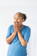 Thoughtful Asian curly male on white background contemplates about something, thinking an idea