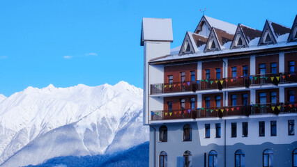 houses on the top of mountain. Early morning at a ski resort, a house against the backdrop of...