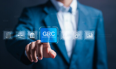 Boost efficiency with GRC Governance Risk and Compliance. Businessman touch GRC icon on digital...
