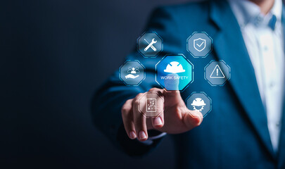 Work safety concept. Businessman touching virtual screen of safety icon for working standard process and zero accidents. regulations and standard in industry.