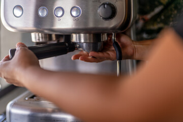 Waiter using coffee machine in a food truck
