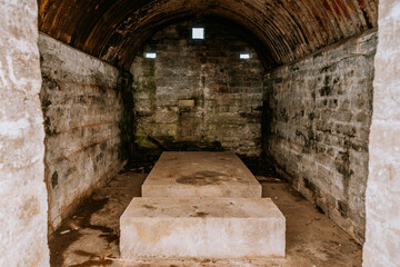 Gibraltar, Britain - January 24, 2024 - arched stone chamber with a raised platform, possibly a...